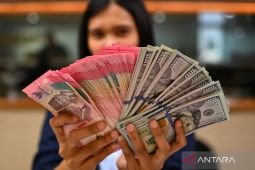 Kamis pagi rupiah menguat menjadi Rp17.713 per dolar AS