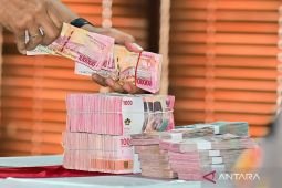 Kamis ini rupiah menguat menjadi Rp18.141 per dolar AS